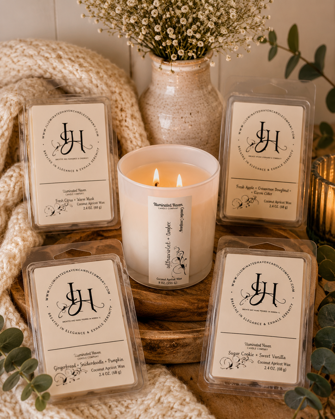 Illuminated Haven Coconut Apricot Wax Melts arranged around a lit candle on a wooden tray with eucalyptus and baby's breath