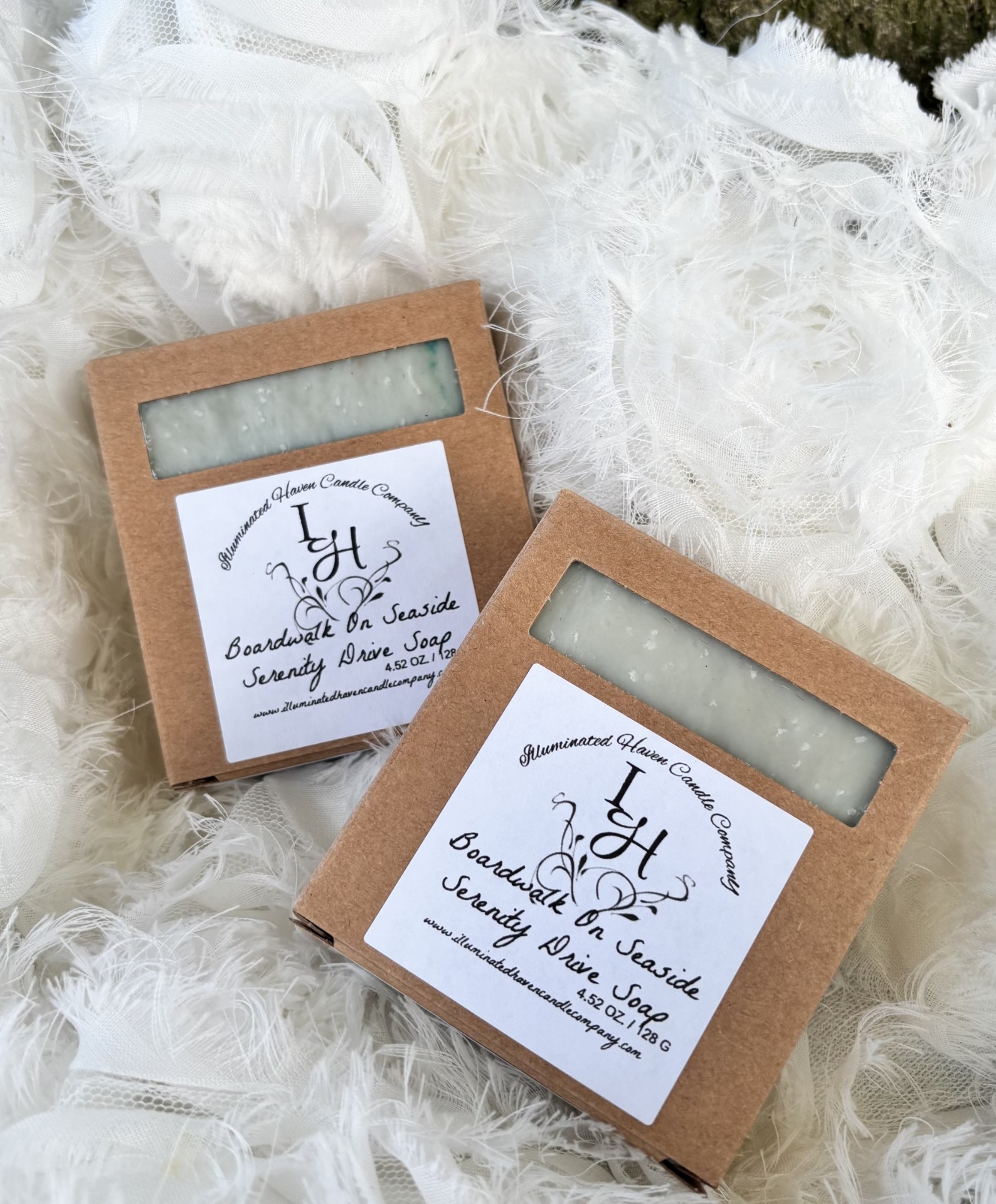 Handmade lavender soap bar on linen with botanicals